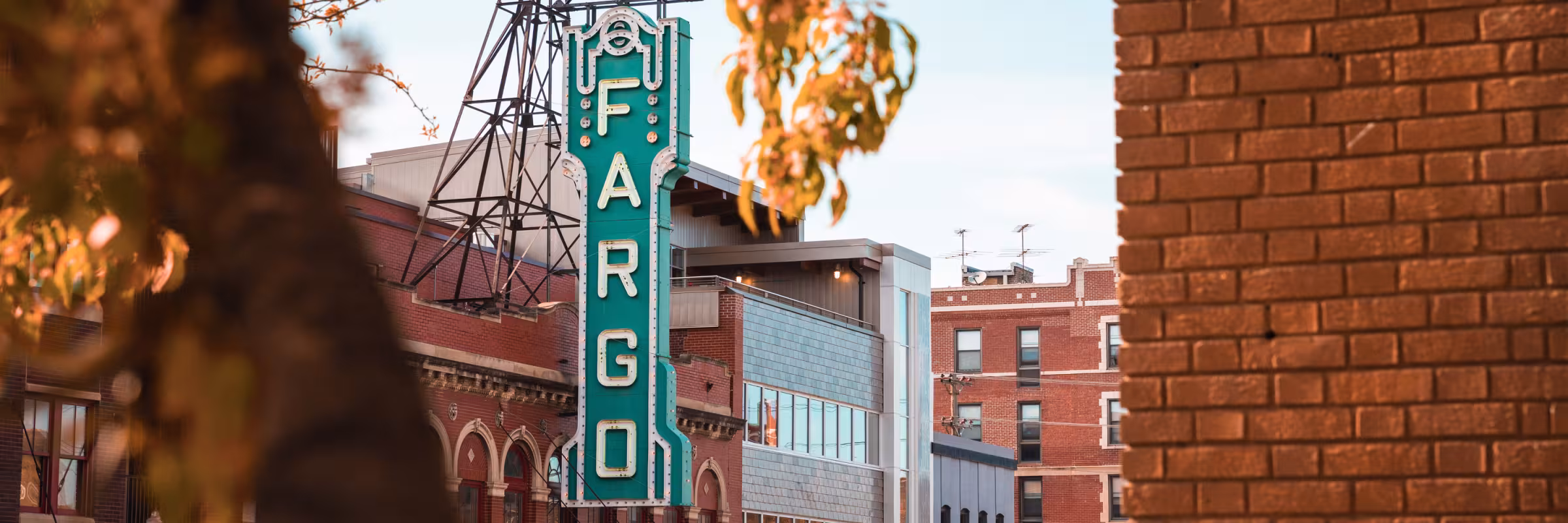 Fargo theatre through trees in the fall